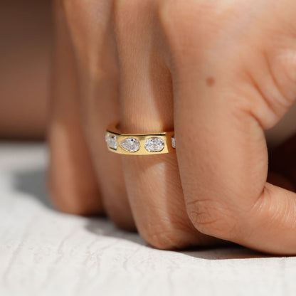 Gold Band Ring Featuring Mix Of Bezel-Set Diamonds Including Oval, Pear And Emerald Cuts Creating A Modern And Luxurious Multi-Shape Design