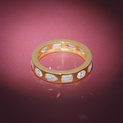 Gold Band Ring Featuring Mix Of Bezel-Set Diamonds Including Oval, Pear And Emerald Cuts Creating A Modern And Luxurious Multi-Shape Design