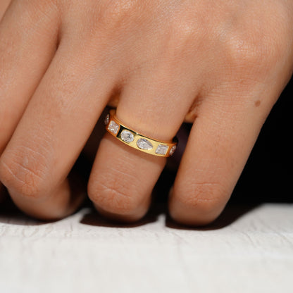 Gold Band Ring Featuring Mix Of Bezel-Set Diamonds Including Oval, Pear And Emerald Cuts Creating A Modern And Luxurious Multi-Shape Design