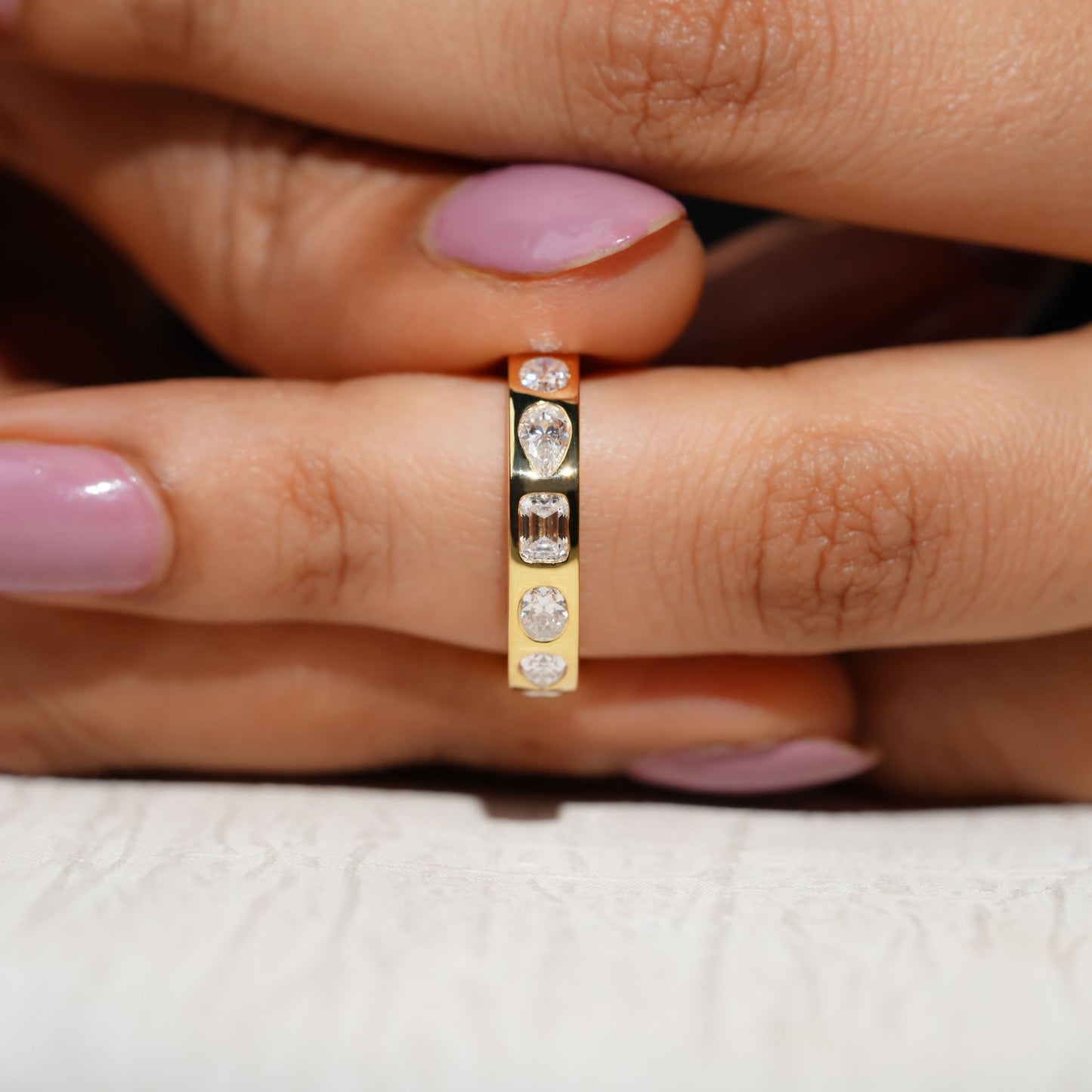 Gold Band Ring Featuring Mix Of Bezel-Set Diamonds Including Oval, Pear And Emerald Cuts Creating A Modern And Luxurious Multi-Shape Design